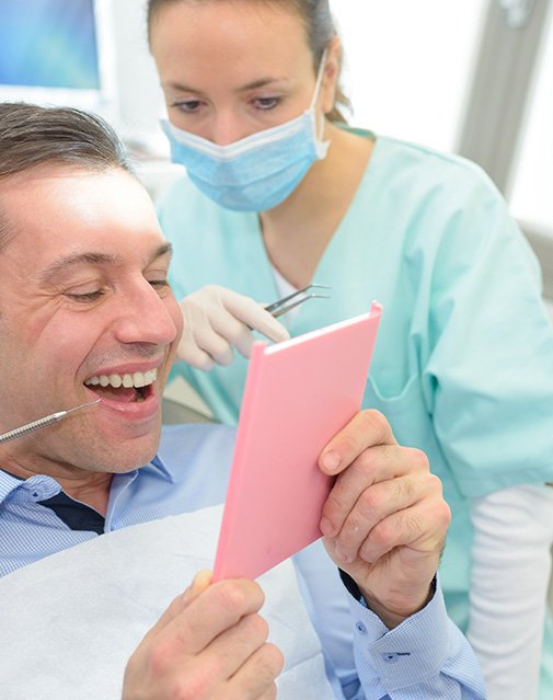 Dentist retreiving CEREC Crown in Carrollton